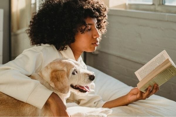 giving a  dog some sound by reading  aloudsome books with him